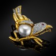 Złota broszka z diamentami, rubinem i perłą